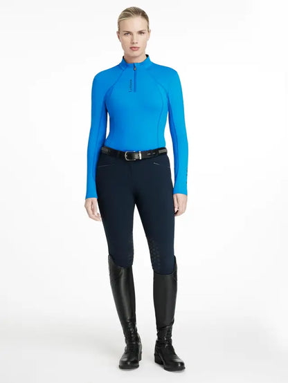 LEMIEUX CLASSIQUE BASE LAYER in Benetton Blue. Women's riding apparel, long sleeve, quarter zip, UV protection. Equestrian fashion.