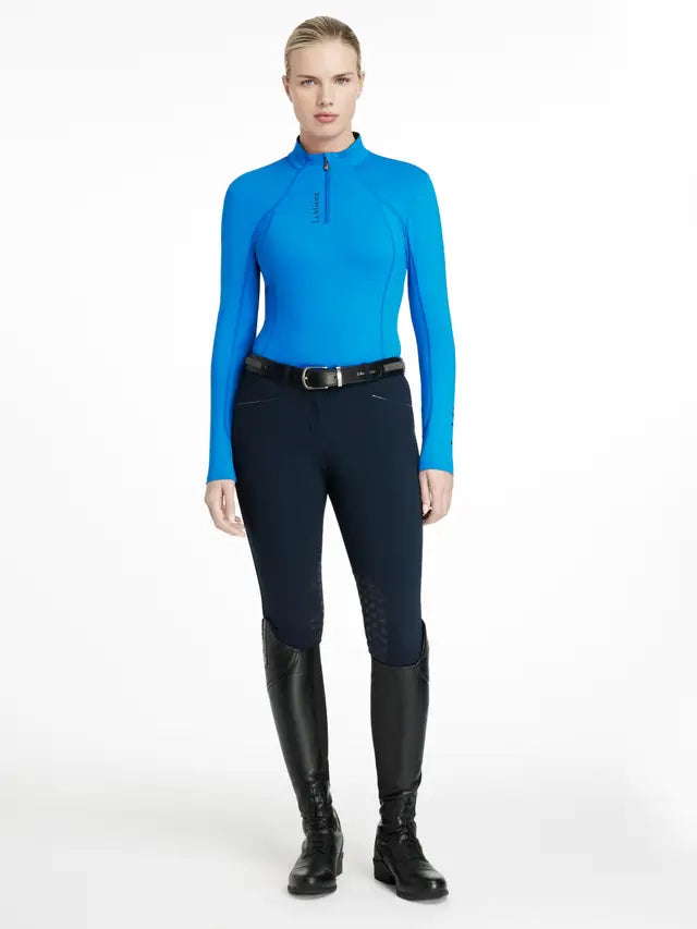 LEMIEUX CLASSIQUE BASE LAYER in Benetton Blue. Women's riding apparel, long sleeve, quarter zip, UV protection. Equestrian fashion.