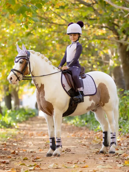 LEMIEUX MINI SUEDE CLOSE CONTACT SQUARE LILAC - Pony Saddle Pad. Lilac Kids Equestrian - Equiflair store. Child rider on pony