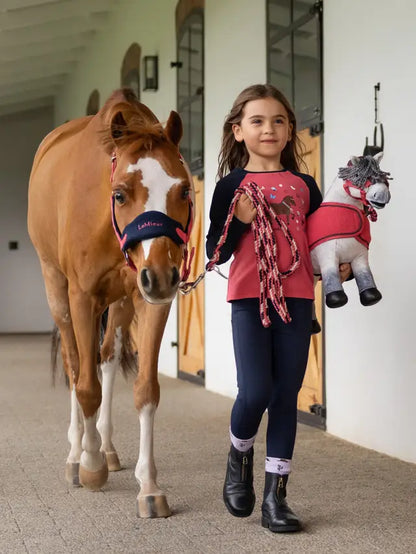 Girl with pony & LeMieux top: "Mini Jamie Chancer" equestrian style for kids. Equiflair's charming outfit.