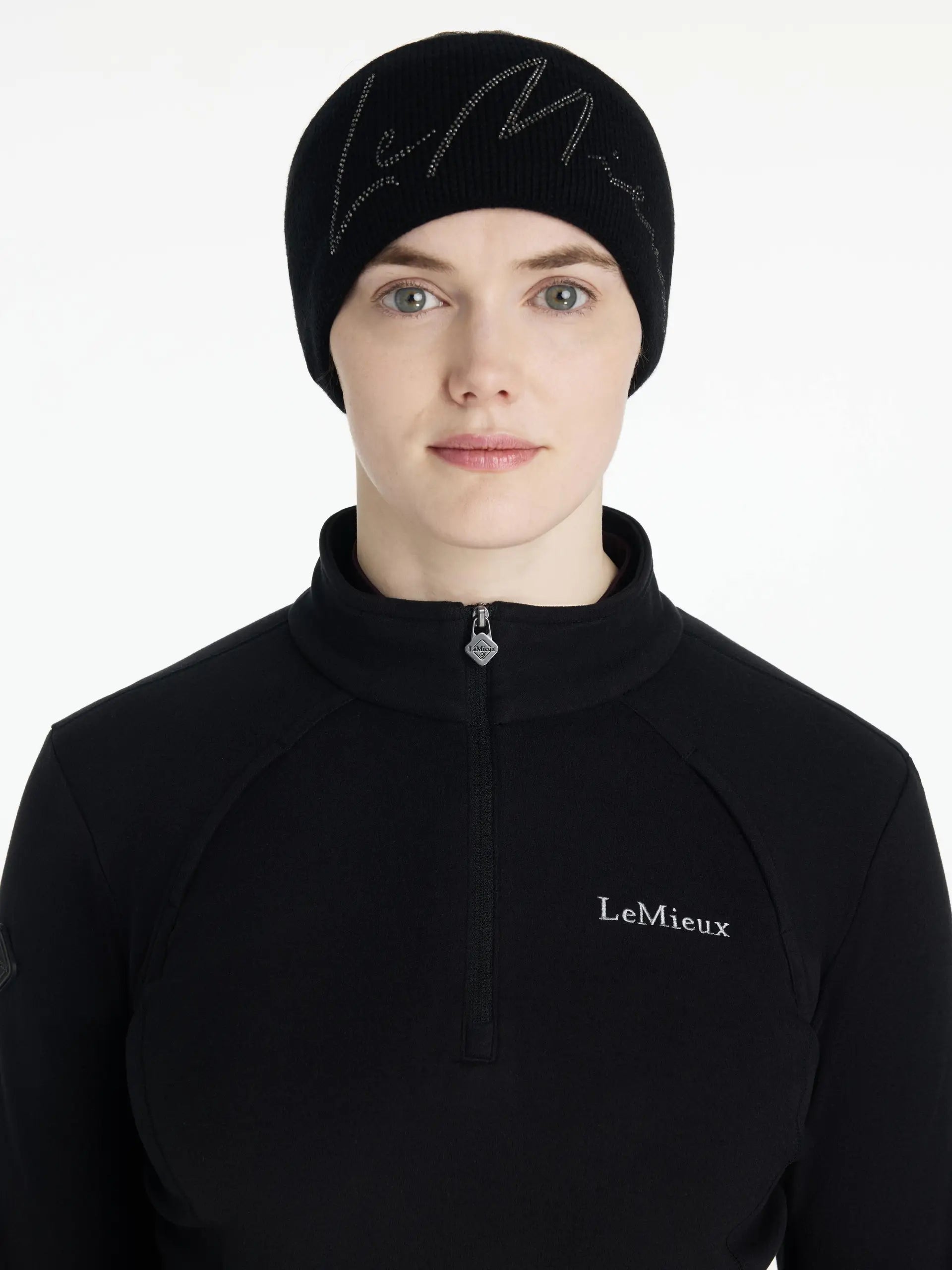 LEMIEUX Sparkle Headband Black: Woman wearing winter hat and top, fashion, equestrian style, headwear.