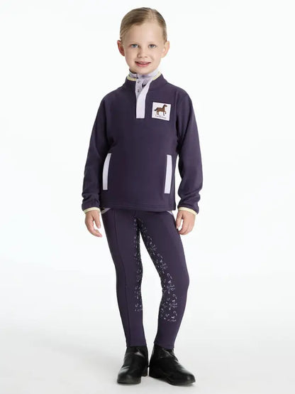 Girl in Lemieux Mini Mae Juniper Fleece: Comfortable Equestrian Apparel for Kids