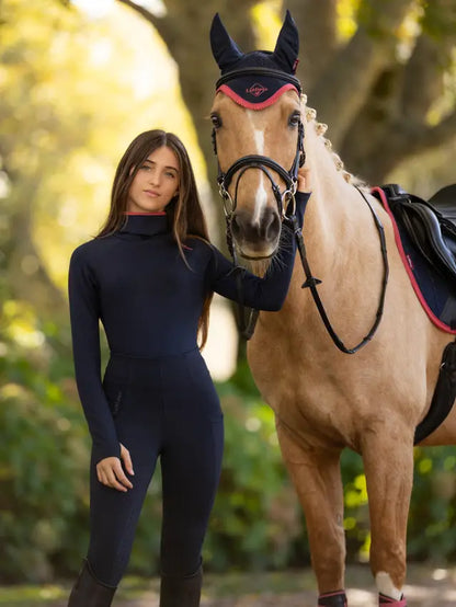LEMIEUX Young Rider Savannah Snood Base Layer in Navy with horse. Riding apparel, equestrian fashion, outdoor photoshoot.