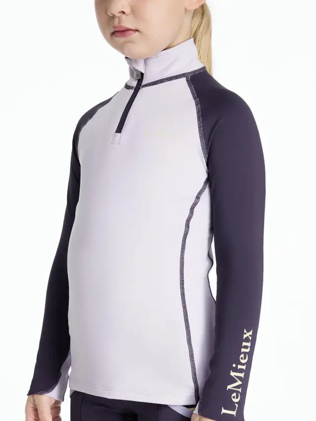LEMIEUX Mini Base Layer in Lilac: Kids Equestrian Riding Apparel. Comfortable moisture-wicking shirt for young riders.