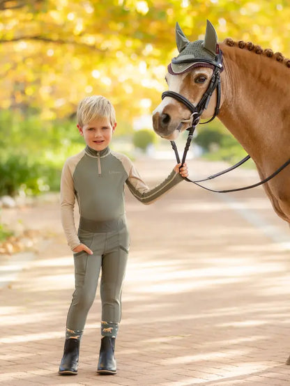 LEMIEUX Mini Pull Ons Rosemary. Child in riding breeches, Equiflair kids equestrian apparel.