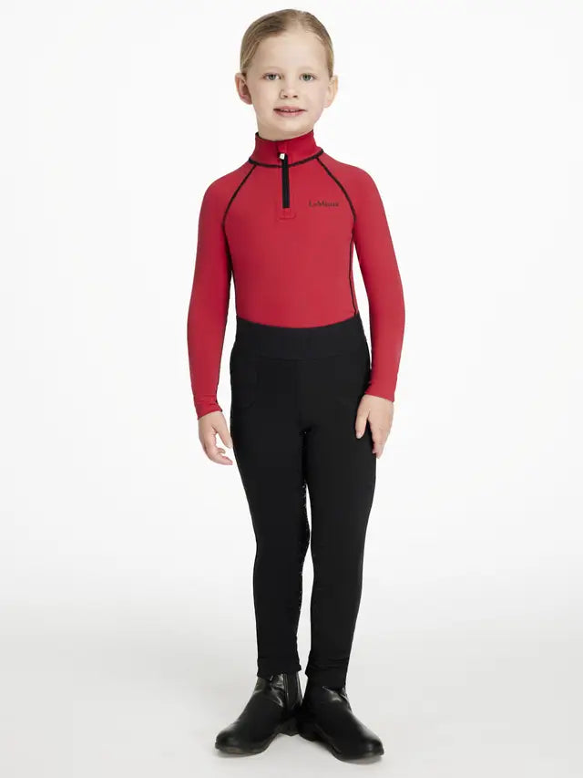 LeMieux Mini Classique Chilli Base Layer - Girl in red equestrian riding top