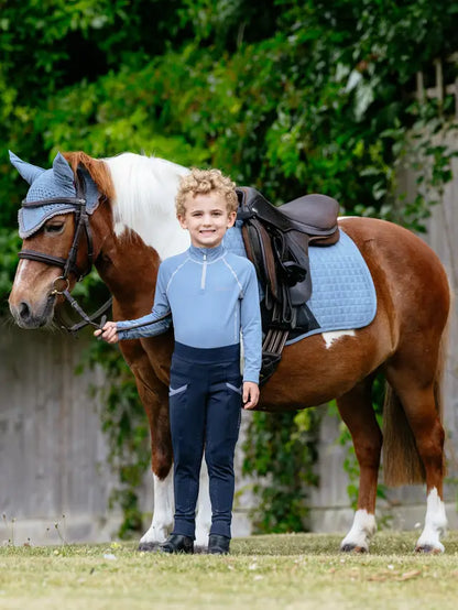 Equestrian Image: Boy with Pony Wearing LEMIEUX MINI SUEDE CLOSE CONTACT SQUARE ICE BLUE pad