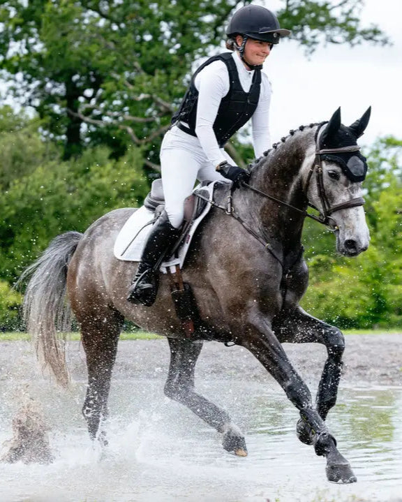 LeMieux Suede Close Contact Square White Saddle Pad: Equestrian Eventing in Water. Stylish and functional horse riding equipment. Equiflair