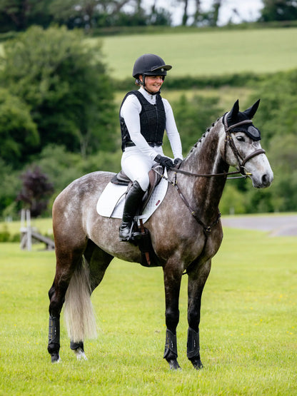 Equestrian: Rider on Grey Horse with White LeMieux Saddle Pad, English Riding Style