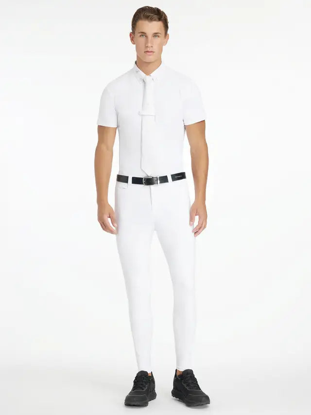 LeMieux Mens White Full Seat Sports Breech: Man in equestrian outfit, riding pants, shirt and sneakers. Competition apparel.