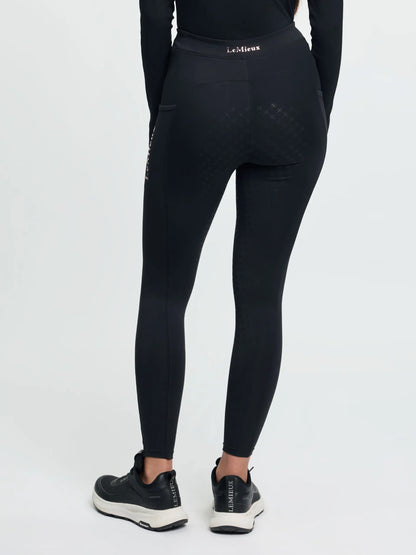 LeMieux Young Rider Sparkle Orla Pull On Black leggings with full seat grip and sneakers.