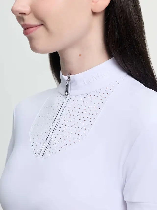 LeMieux Young Rider white short sleeve show shirt with perforated neckline and zipper.