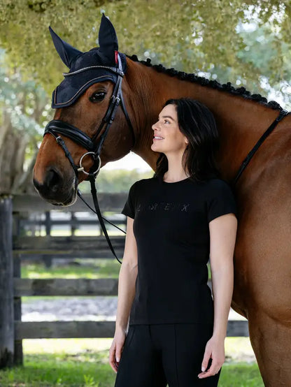 Woman in black LeMieux rhinestone t-shirt next to a brown horse