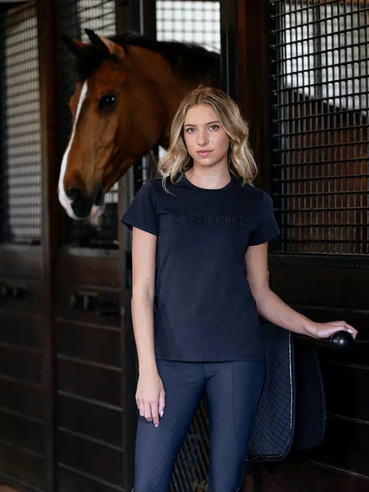 LeMieux Brilliance T-Shirt Navy: Woman in riding outfit with horse.