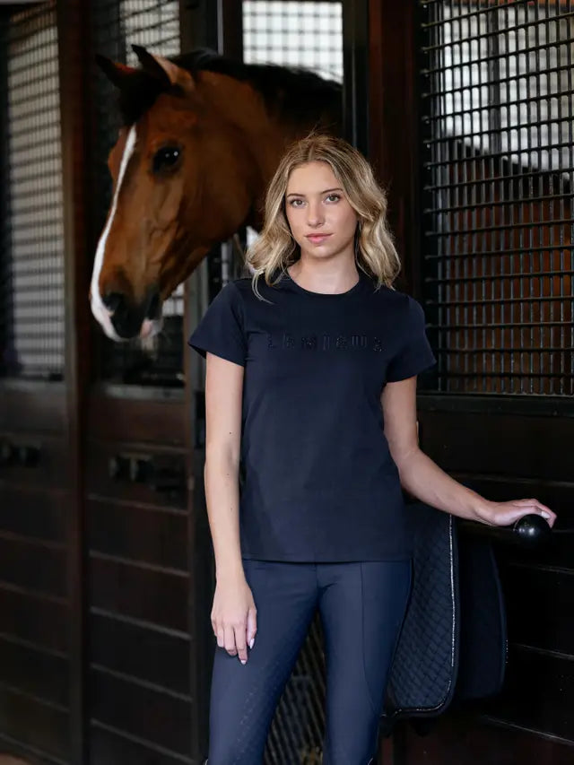 LeMieux Brilliance T-Shirt Navy: Woman in riding outfit with horse.