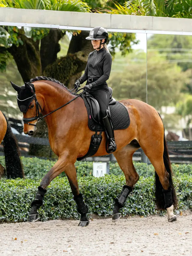 LeMieux Brilliance Dressage Square Saddle Pad Black on horse with rider at competition