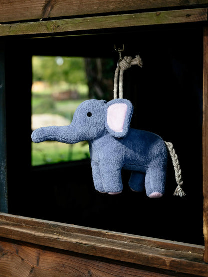 LeMieux Plush Horse Toy Elephant hanging in a stable, keeping horses entertained.