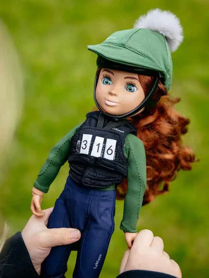 LeMieux equestrian doll with black body protector, green helmet, and competition bib with numbers 316.