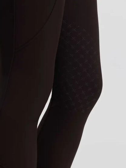 Brown LeMieux Brilliance equestrian breeches featuring detailed knee grip pattern close-up.