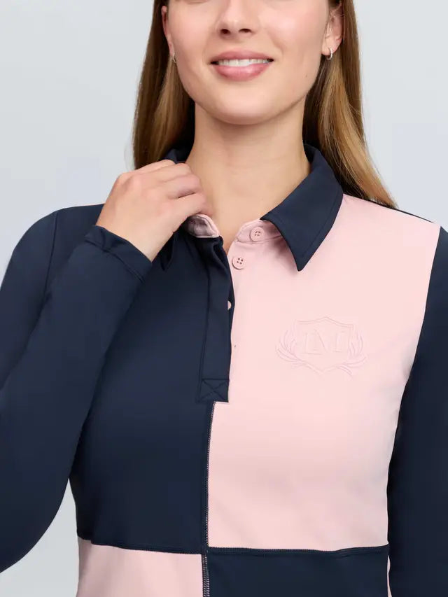 LeMieux Harlequin Rugby Shirt base layer in petal pink and navy blue. UV50+ equestrian long sleeve top with LM monogram crest.