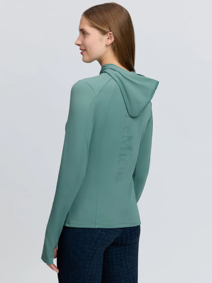 Green LeMieux Heidi Hooded Mid Layer training top with UV40+ protection and perforated logo on back.