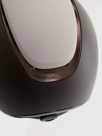 Close-up of LeMieux logo on a Matte Stone equestrian riding helmet