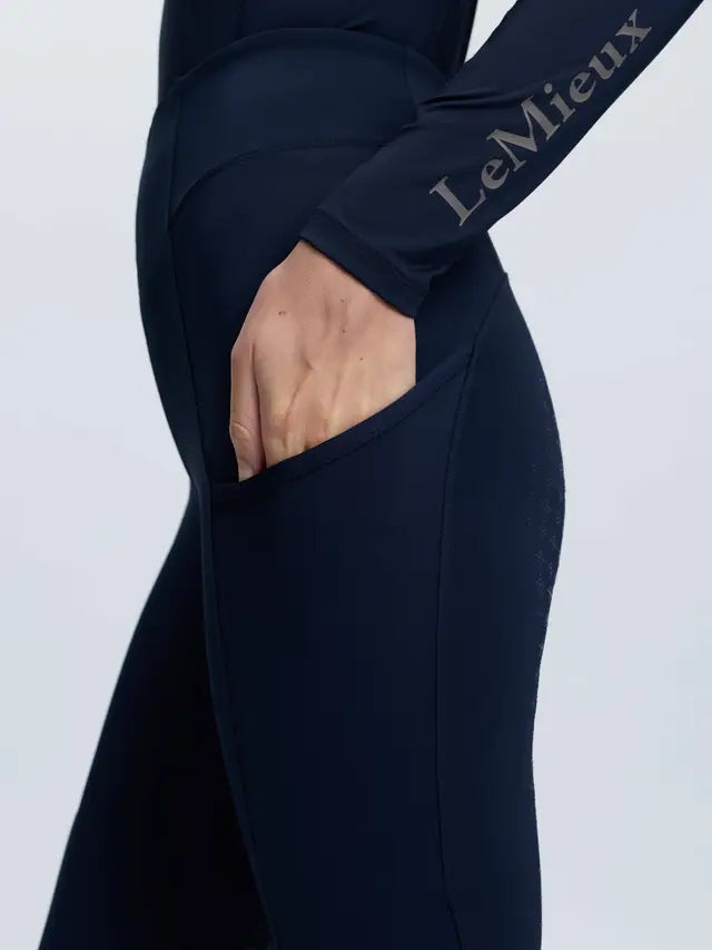 LeMieux navy Naomi tall pull-on breeches with side phone pocket and full silicone seat.