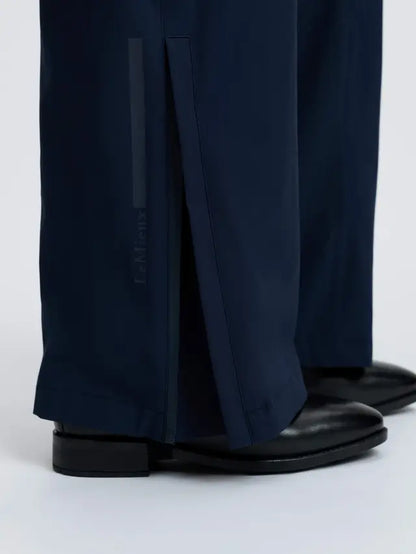 LeMieux navy waterproof equestrian trousers with split hem and subtle embossed logo.