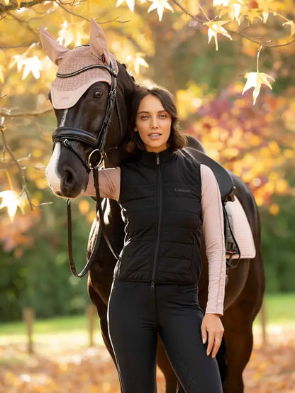 LeMieux Lily Lightweight Gilet Black: Woman in riding gear with a horse in autumn setting