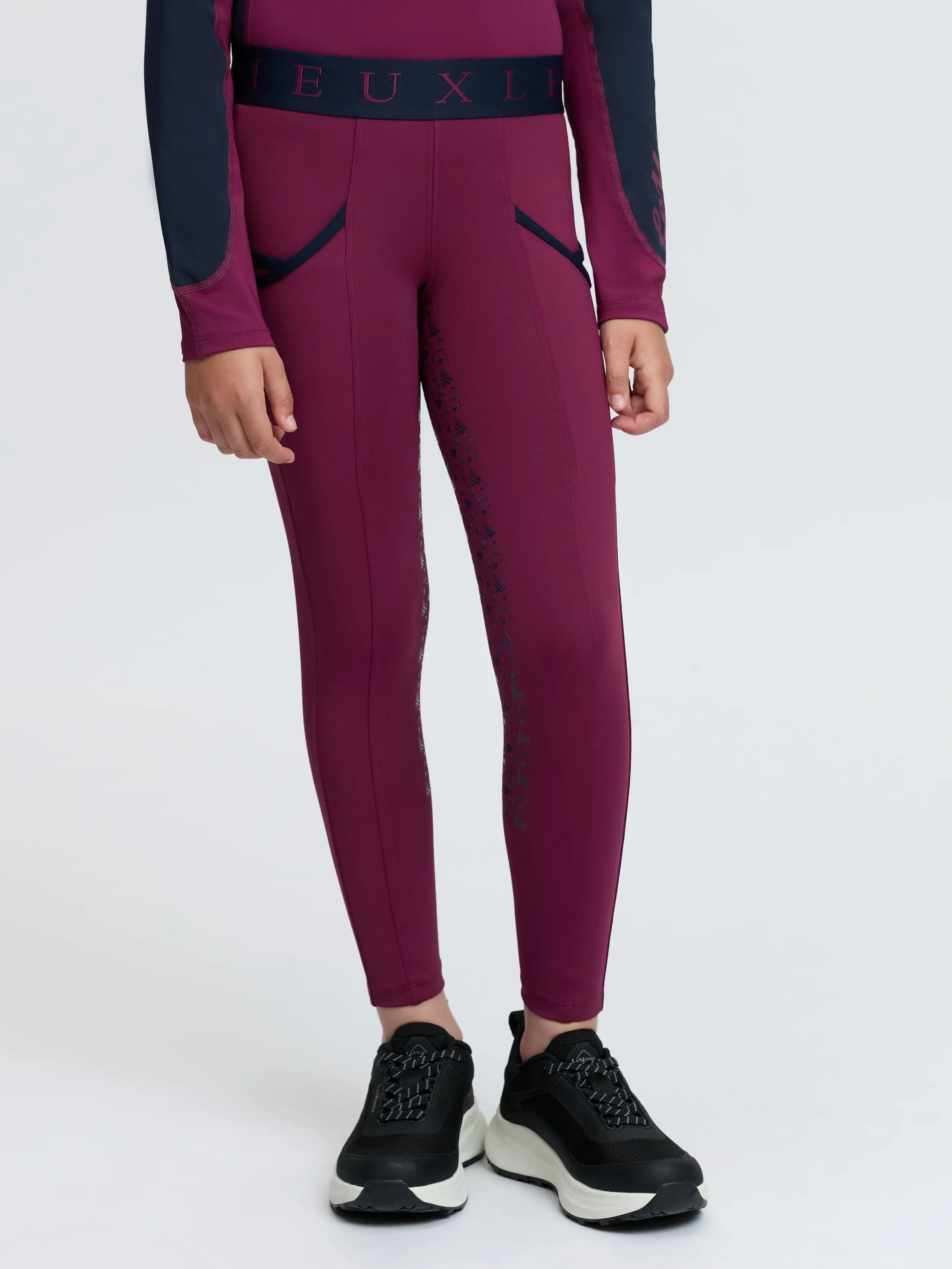 LeMieux plum kids pull-on riding breeches with full seat silicone grip and matching long sleeve top.