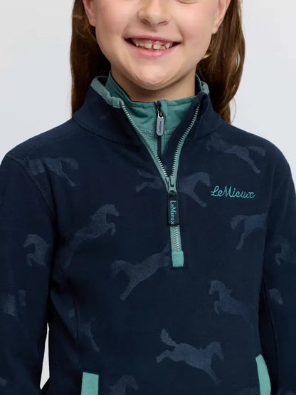 LeMieux kids navy blue quarter zip fleece with horse print and teal accents.