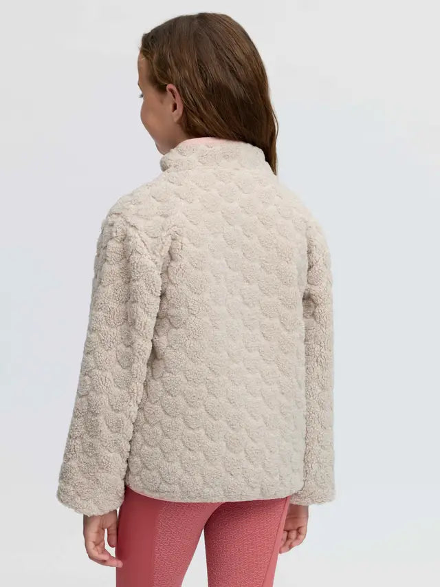 Back view of girl wearing beige heart pattern borg fleece jacket and pink leggings.