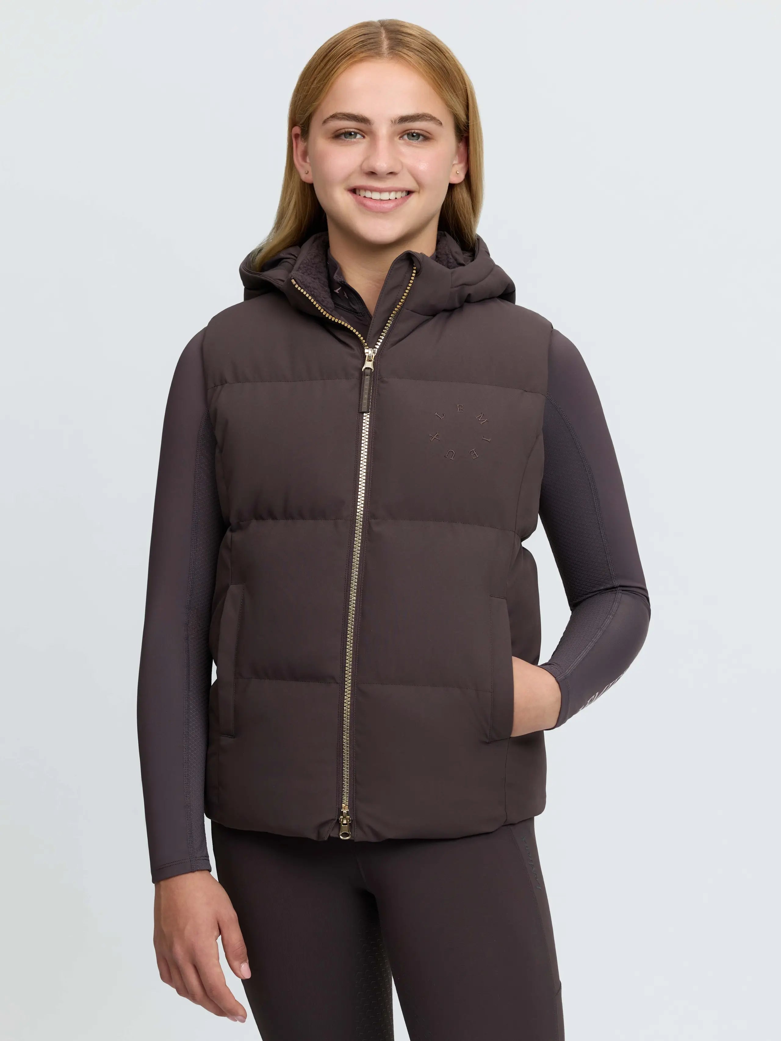 Young girl in brown Lemieux Joey hooded puffer gilet and matching leggings