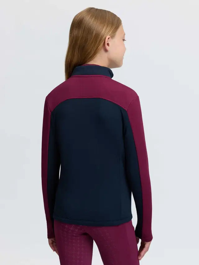 LeMieux Young Rider Bethany Zip Through Mid Layer jacket in blackberry, worn by a girl from the back.