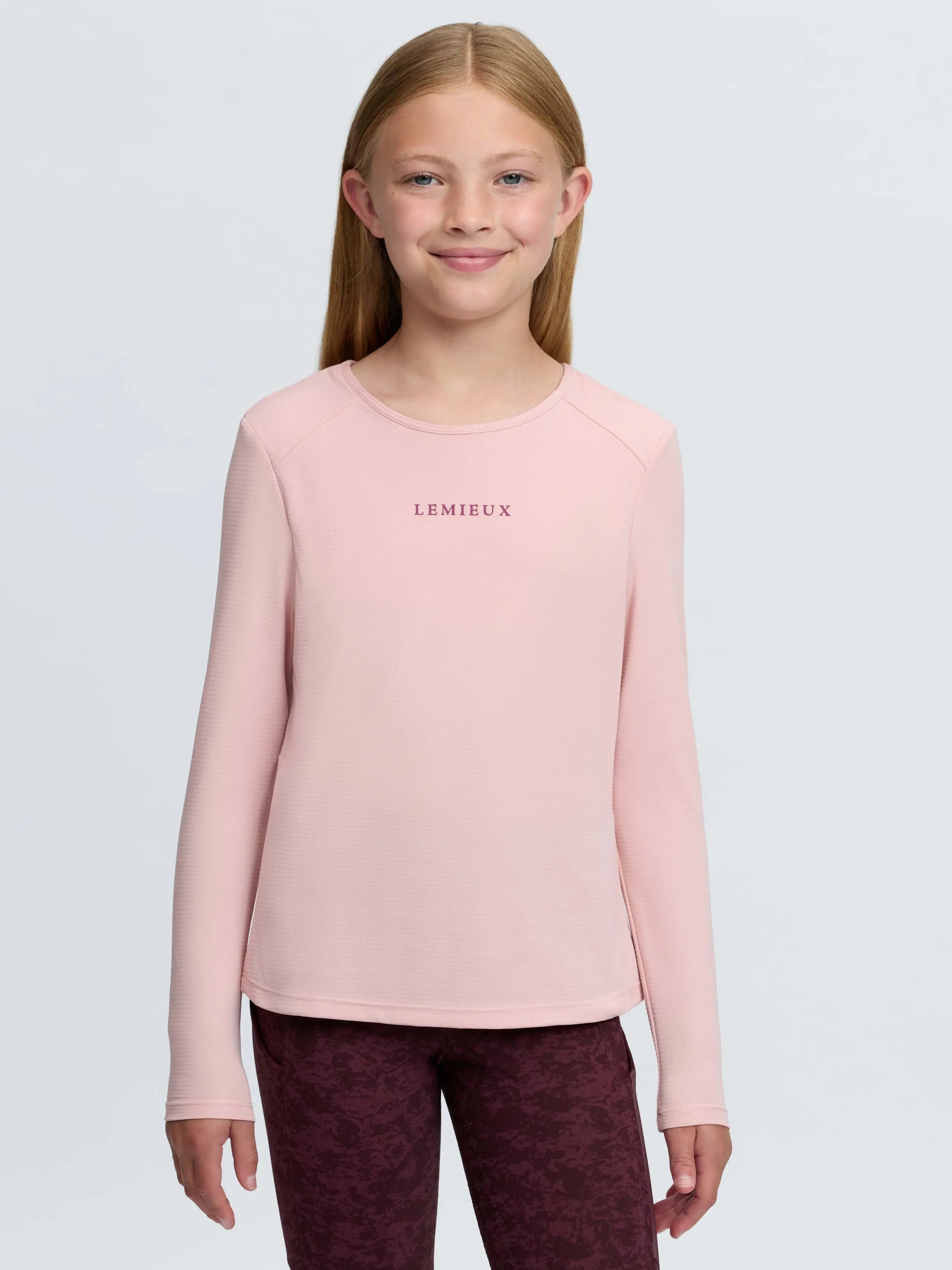 Pink LEMIEUX Young Rider Hybrid Sports Top with built-in bralette for girls' equestrian wear.