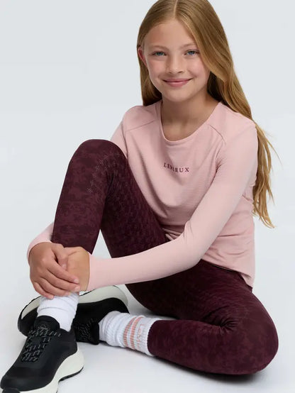 LeMieux Young Rider Hybrid Sports Top in Petal Pink with built-in bralette for comfort.