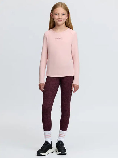 Young Rider's pink long-sleeved sports top with 'LeMieux' logo and patterned leggings.