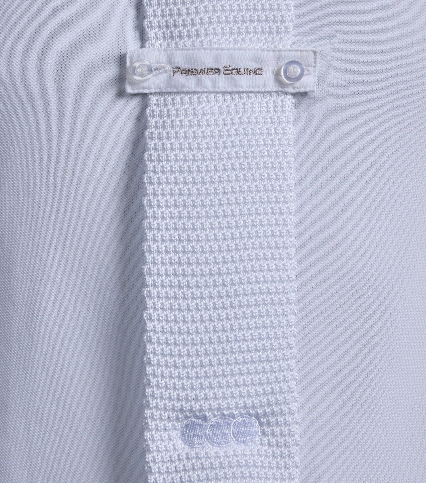 Premier Equine Men's Knitted Tie White: Stylish equestrian competition attire detail close-up.