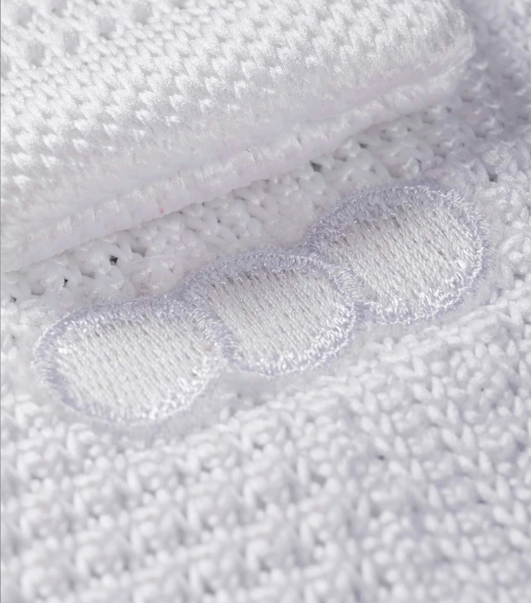 Premier Equine Men's Knitted Tie - White: Stylish competition tie for the modern equestrian. Close-up texture detail.