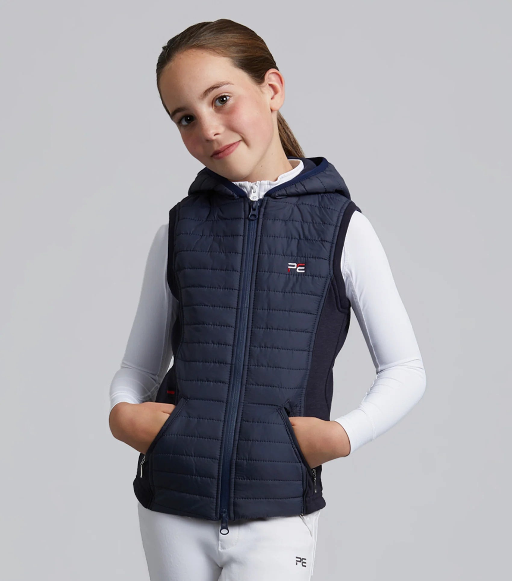 Premier Equine Girl's Navy Lamera Hybrid Riding Gilet. Quilted, hooded vest for young equestrian athletes. - Clothing…
