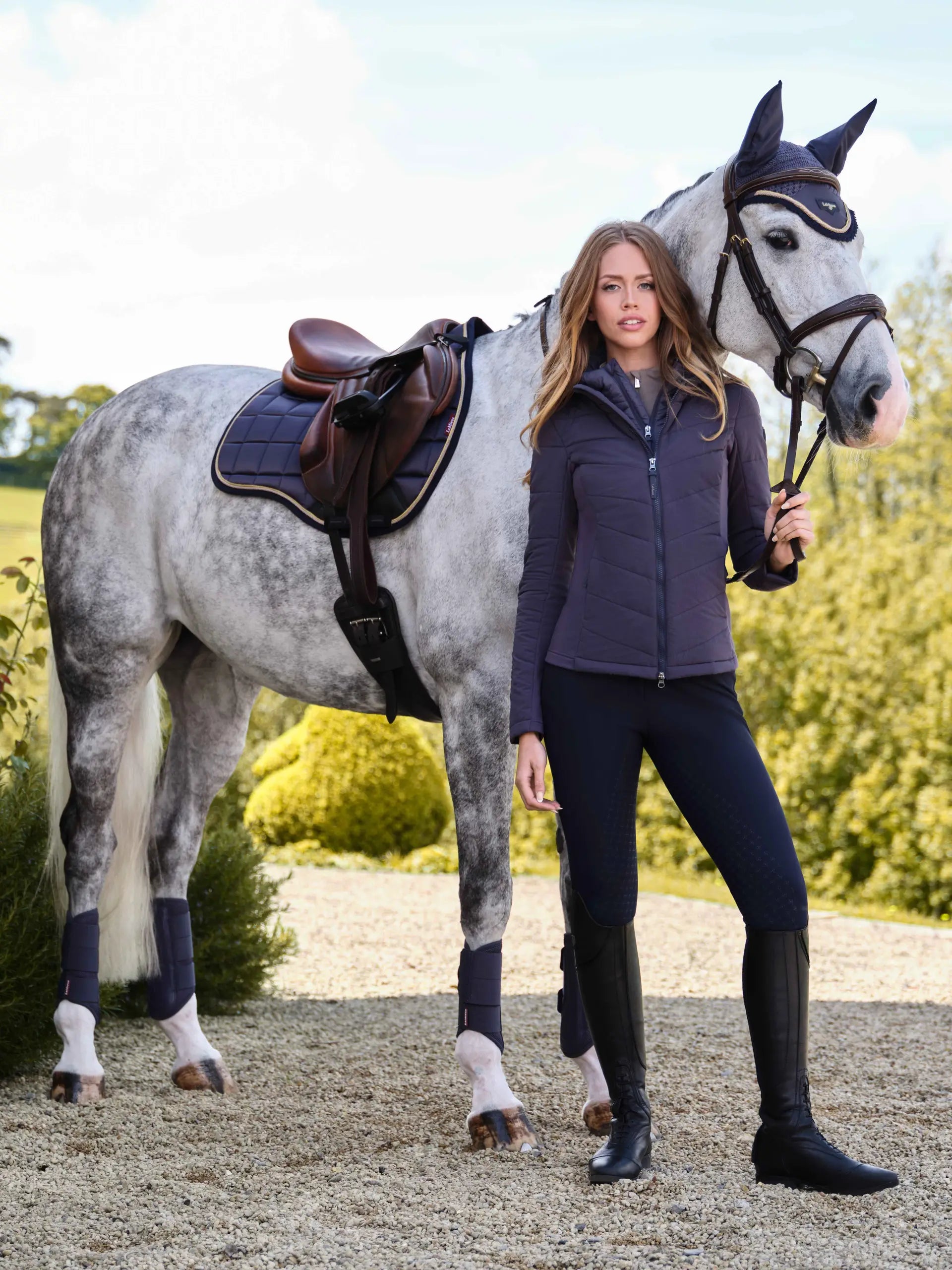 LEMIEUX Loire Collection Classic GP Square Dusk Blue saddle pad, horse, and woman in riding apparel: Equestrian Fashion.