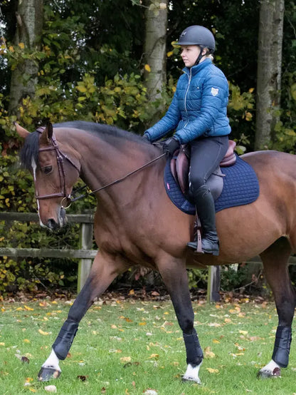 Rider on Horse with LeMieux Navy Cotton GP Square Saddle Pad - Equestrian Gear