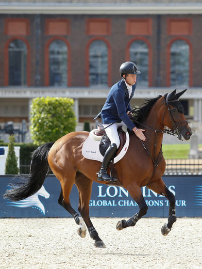Scott Brash show jumping with horse, wearing LEMIEUX Suede Eurojump Square White saddle pad. Equestrian event image.