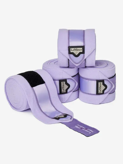 LeMieux Loire Polo Bandages Wisteria: Purple horse leg wraps for support and protection, featuring satin detail and logo.