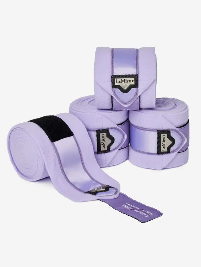LeMieux Loire Polo Bandages Wisteria: Purple horse leg wraps for support and protection, featuring satin detail and logo.
