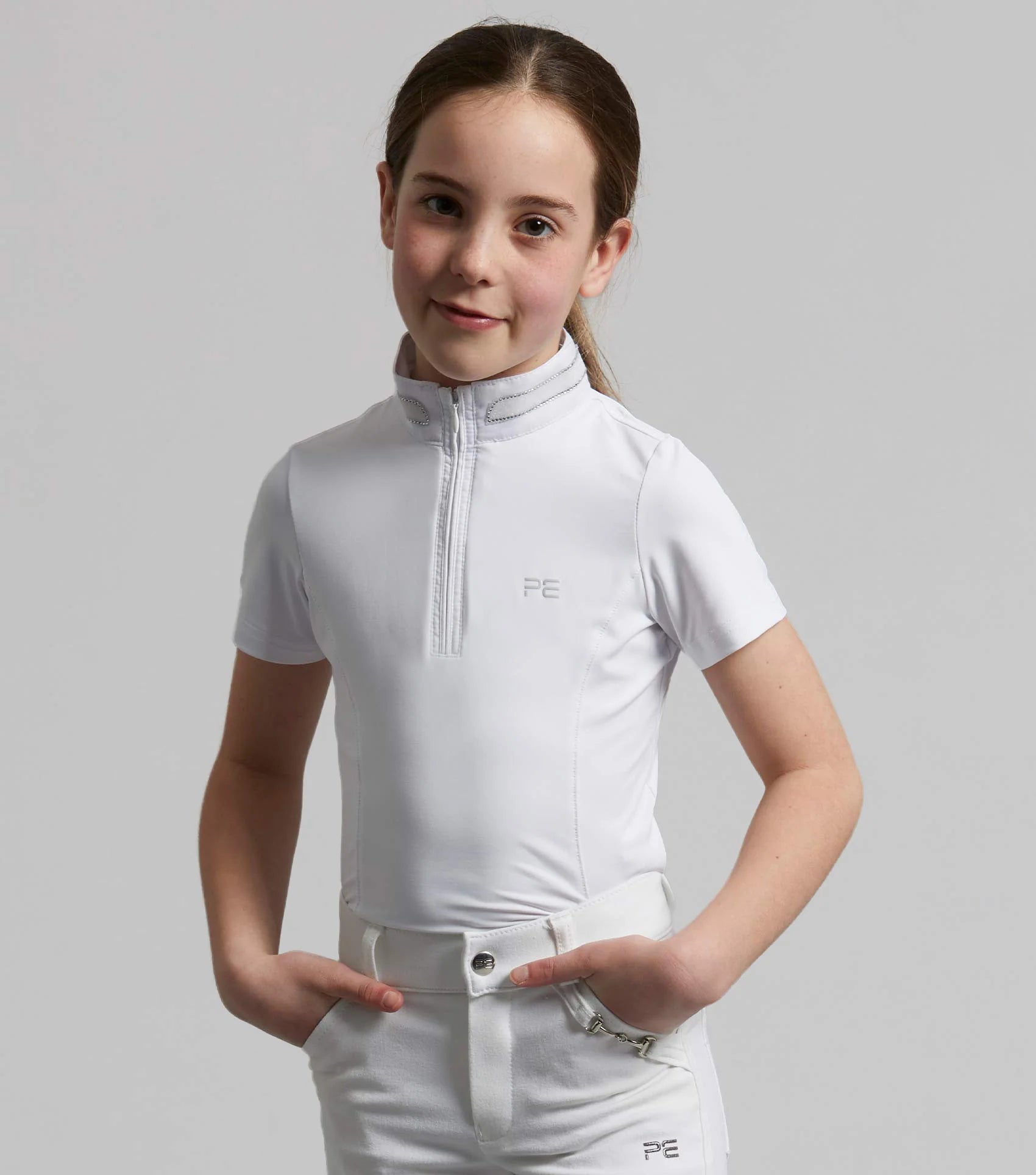Girl wearing white Diamanté show shirt equestrian apparel
