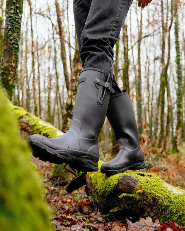 LEMIEUX MENS STRIDE WELLINGTON BOOTS BLACK on mossy log in forest
