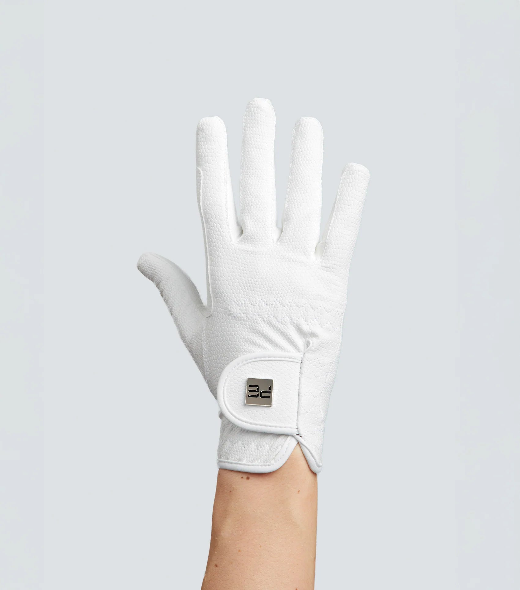 Premier Equine Metaro Junior White Riding Glove. Reptilian texture, touchscreen compatible equestrian glove for young riders.
