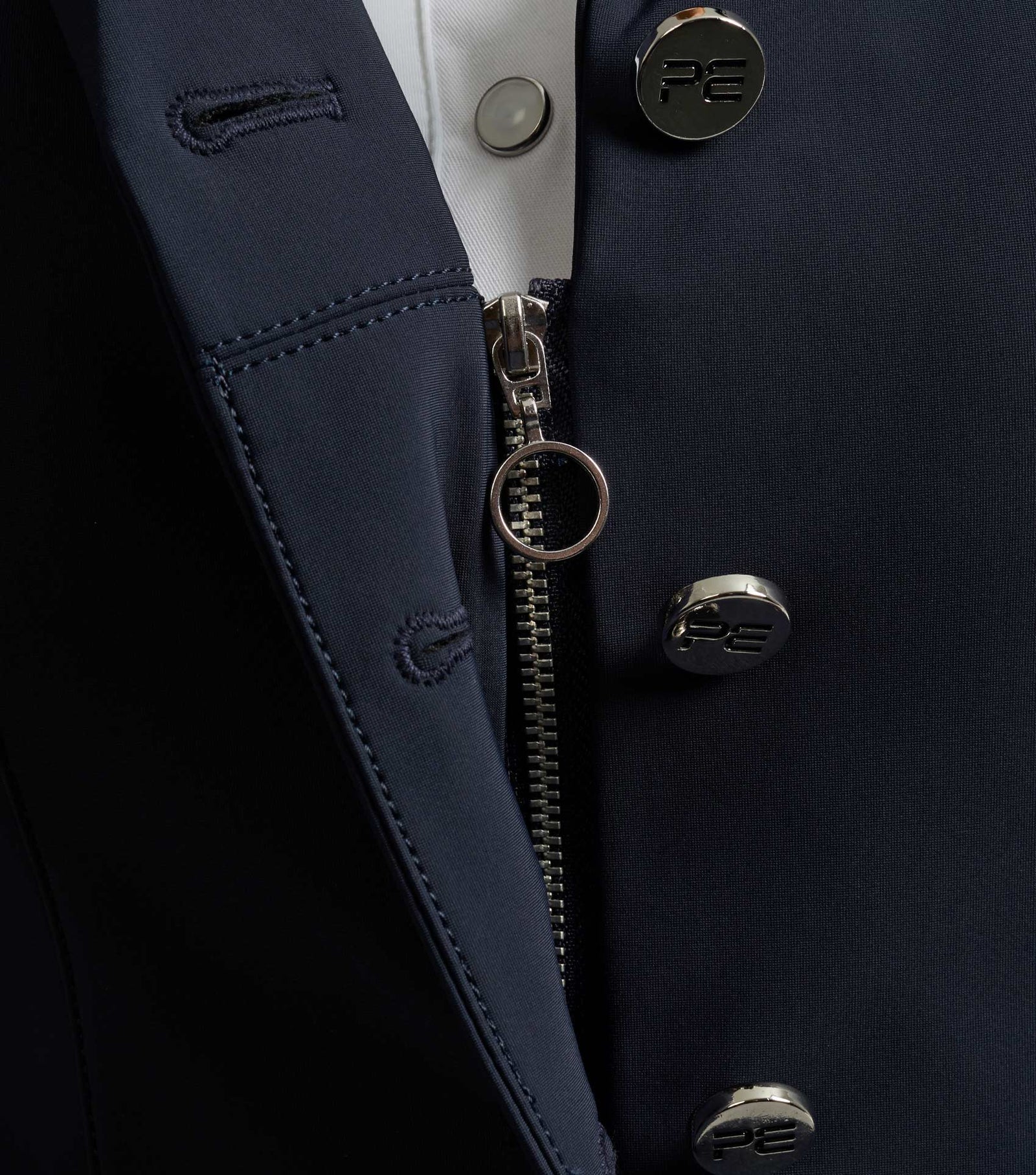 Premier Equine Navy Competition Jacket Close-up: Zipper, Buttons, and Stylish Equestrian Show Jacket Details