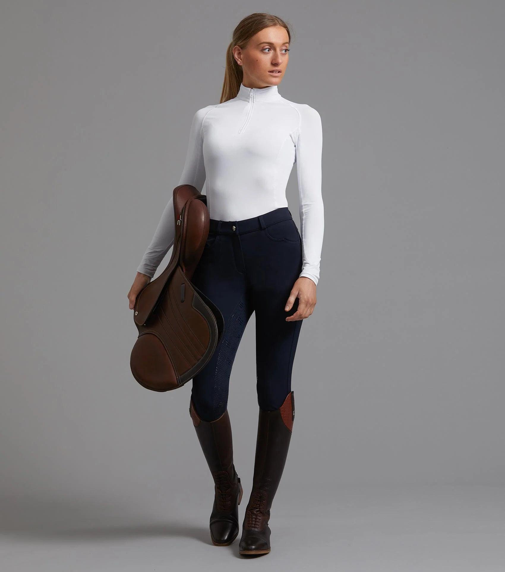 Premier Equine White Technical Riding Top for Ladies with Saddle, Breeches, and Boots